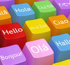 Teclas coloridas de teclado, cada tecla tem "Olá" escrito em idiomas diferentes.